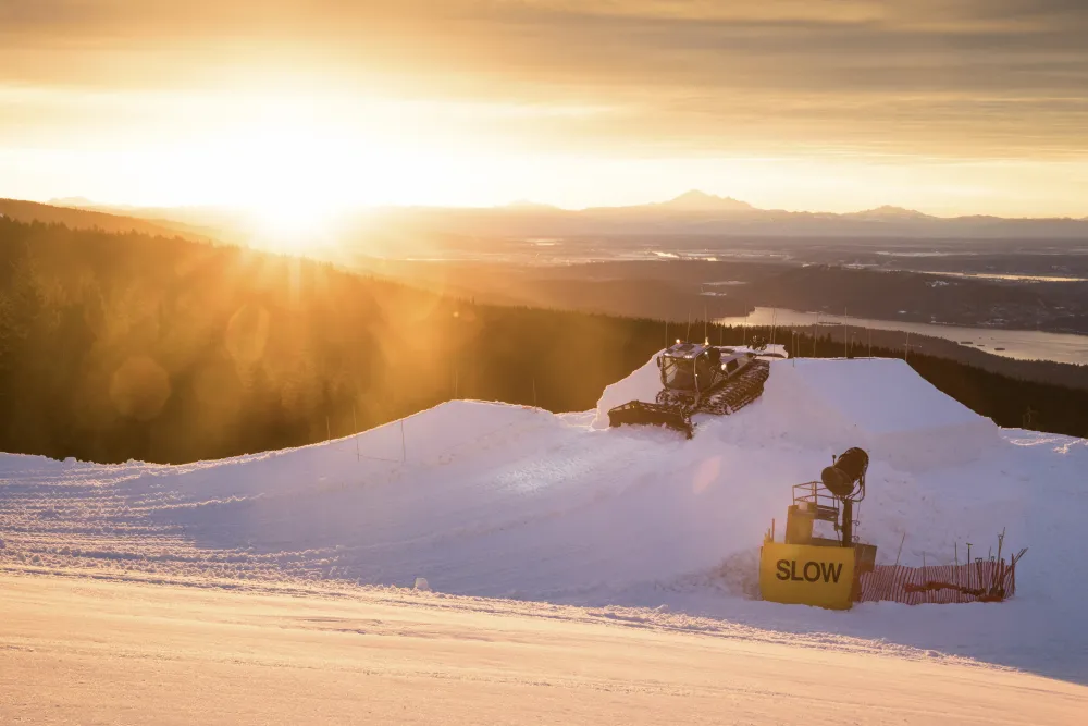 Grouse Mountain Parks team builds the unCoked course and sunset. Photo: Jussi Grznar. Private snow park, snowboard slopestyle, Sunrise snow shoot, Snowboard film with world-class athletes, Social media content for winter sports brands,